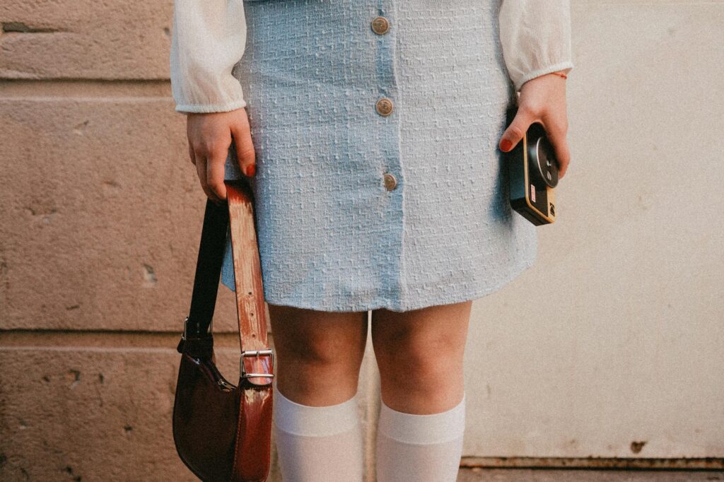 vintage style with blue skirt and retro camera