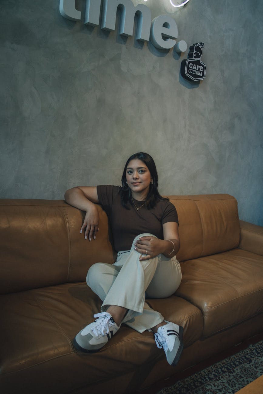 relaxed woman sitting in modern cafe interior